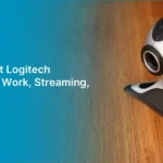 Logitech webcam on a wooden surface with Alahdeen's B2B platform promotion for bulk purchasing and supplier direct chat.