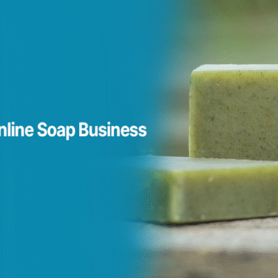 Natural handmade soap bars placed on a wooden surface, representing an online soap business guide by Alahdeen.
